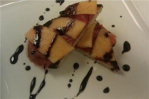 Prosciutto and melon bruscetta with a balsamic drizzle